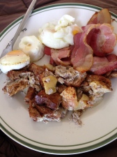 four baked dippy eggs, three baked pieces of thick bacon and apple cinnamon french toast